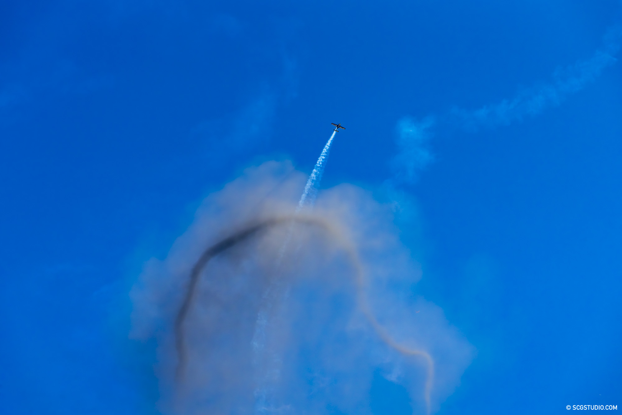 Air performer went through the smoke ring in the sky